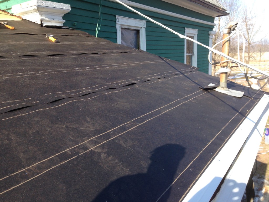 tar paper and drip edge protect the roof from a winter storm