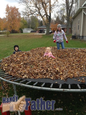 fun on the trampoline covered with fallen leaves